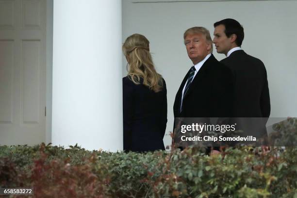 President Donald Trump walks along the West Wing colonnade with his daughter Ivanka Trump and his son-in-law and Senior Advisor to the President for...