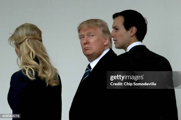 President Donald Trump walks along the West Wing colonnade with his daughter Ivanka Trump and his son-in-law and Senior Advisor to the President for...