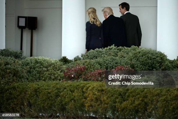 President Donald Trump walks along the West Wing colonnade with his daughter Ivanka Trump and his son-in-law and Senior Advisor to the President for...