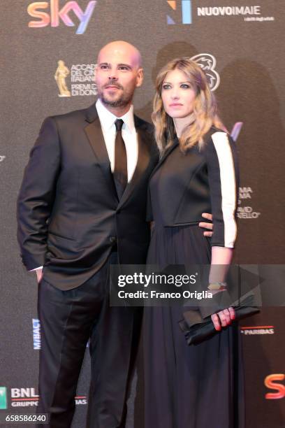 Marco D'Amore and Daniela Maiorana walk the red carpet of the 61. David Di Donatello on March 27, 2017 in Rome, Italy.