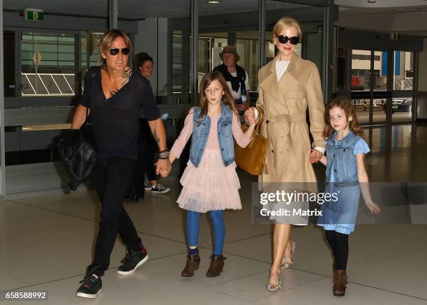 Nicole Kidman and Keith Urban arrive at Sydney airport with their daughters Faith Margaret and Sunday Rose on March 28, 2017 in Sydney, Australia.