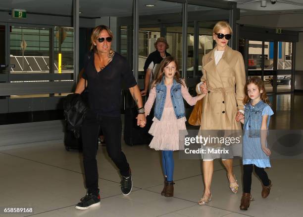 Nicole Kidman and Keith Urban arrive at Sydney airport with their daughters Faith Margaret and Sunday Rose on March 28, 2017 in Sydney, Australia.