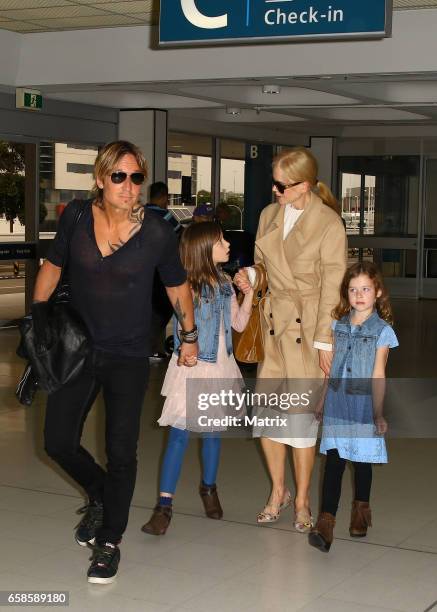 Nicole Kidman and Keith Urban arrive at Sydney airport with their daughters Faith Margaret and Sunday Rose on March 28, 2017 in Sydney, Australia.