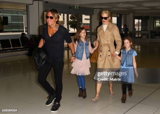 Nicole Kidman and Keith Urban arrive at Sydney airport with their daughters Faith Margaret and Sunday Rose on March 28, 2017 in Sydney, Australia.