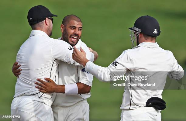 Jeetan Patel of New Zealand is congratulated on taking the wicket of Hashim Amla of South Africa during day four of the Test match between New...