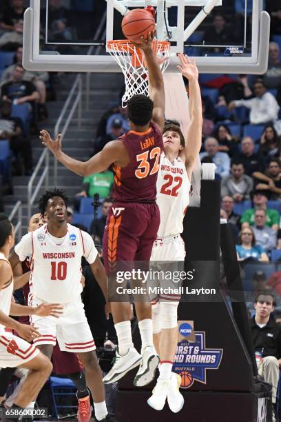 Zach LeDay of the Virginia Tech Hokies takes a shot over Ethan Happ of the Wisconsin Badgers during the First Round of the NCAA Basketball Tournament...