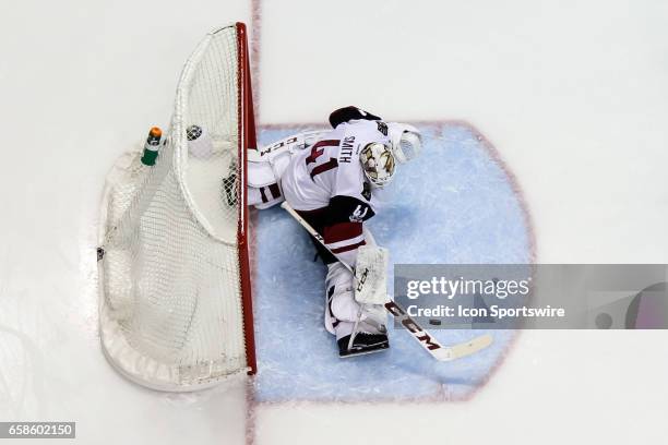 Arizona Coyotes Goalie Mike Smith makes a save during an NHL hockey game between the Arizona Coyotes and the St. Louis Blues. The Blues defeated the...