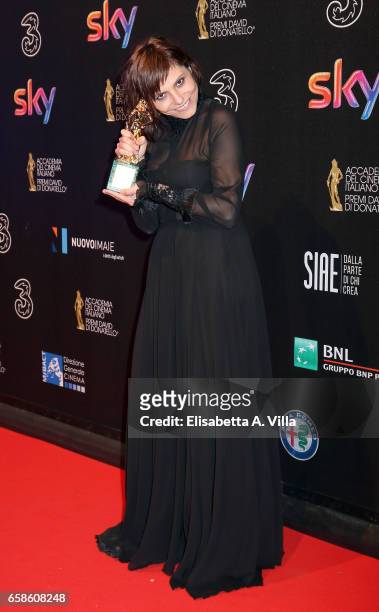 Actress Antonia Truppo poses with her Best Supporting Actress award at the end of the 61. David Di Donatello ceremony on March 27, 2017 in Rome,...