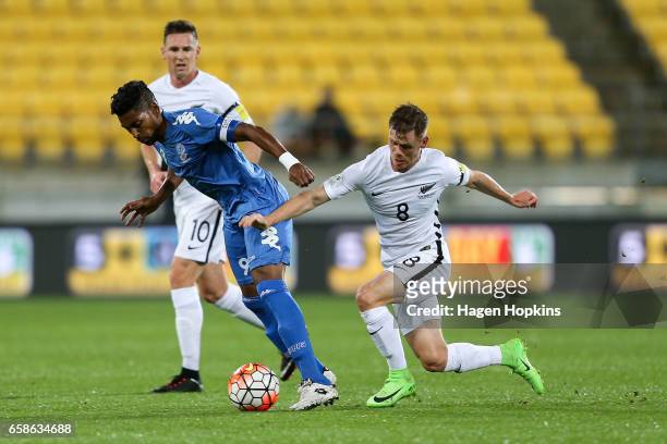 Roy Krishna of Fiji is tackled by Michael McGlinchey of New Zealand during the 2018 FIFA World Cup Qualifier match between the New Zealand All Whites...