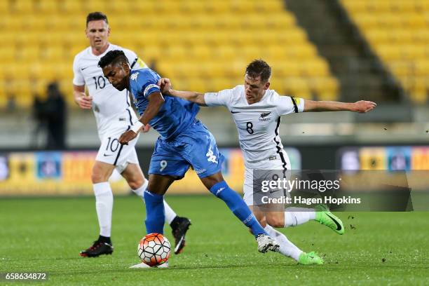 Roy Krishna of Fiji is tackled by Michael McGlinchey of New Zealand during the 2018 FIFA World Cup Qualifier match between the New Zealand All Whites...