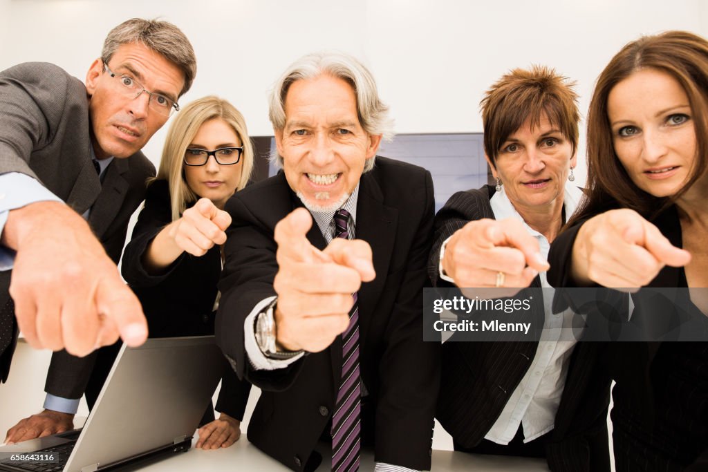 Who`s to Blame? Business People Pointing Finger in Conference Room