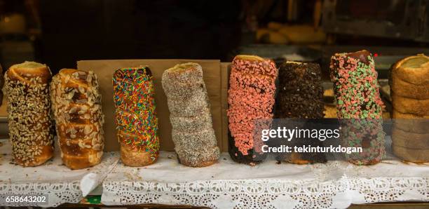 trdelnik dessert cooking over an open flame in the streets of lviv ukraine - trdelník stock pictures, royalty-free photos & images