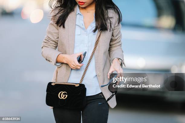 May Berthelot, Head of Legal at Videdressing.com and fashion blogger, wears black shoes, New Look pants, a Topshop blue shirt, an Asos beige blazer...