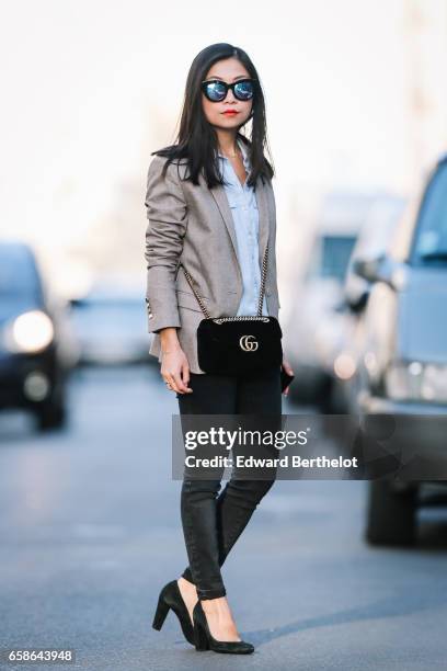 May Berthelot, Head of Legal at Videdressing.com and fashion blogger, wears black shoes, New Look pants, a Topshop blue shirt, an Asos beige blazer...