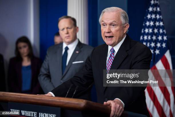 Attorney General Jeff Sessions, right, accompanied by White House press secretary Sean Spicer, talks to reporters and members of the media during the...