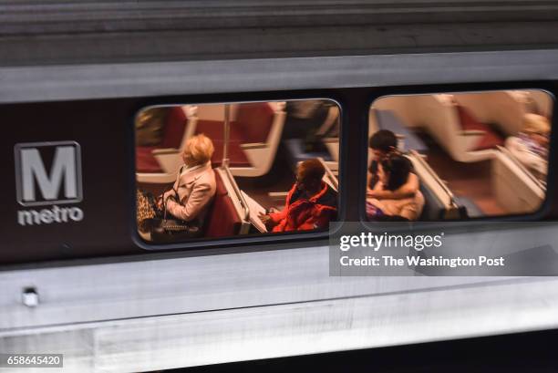 Commuters are seen riding the train at McPherson Square Metro Station on March 30, 2016 in Washington, D.C. Metro's top officials warned Wednesday...