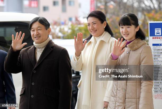 Crown Prince Naruhito , Crown Pricness Masako and their daughter Princess Aiko wave to well-wishers on arrival at Nagano Station on March 27, 2017 in...