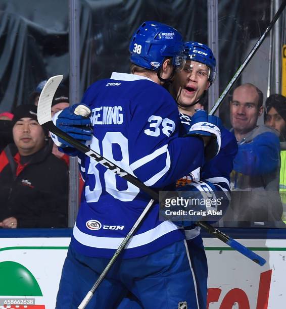 Steven Oleksy of the Toronto Marlies celebrates his goal with team mate Colin Greening against the Syracuse Crunch on March 26, 2017 at Ricoh...