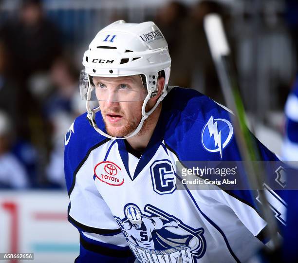 Erik Condra of the Syracuse Crunch prepares for a face-off against the Toronto Marlies on March 26, 2017 at Ricoh Coliseum in Toronto, Ontario,...