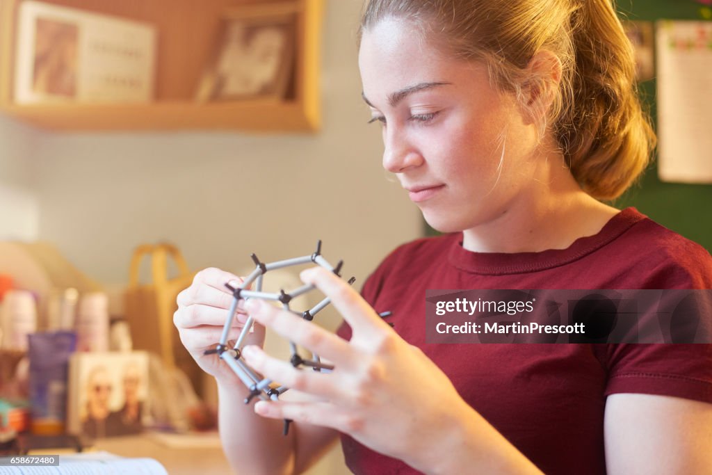 Putting together a molecular model kit