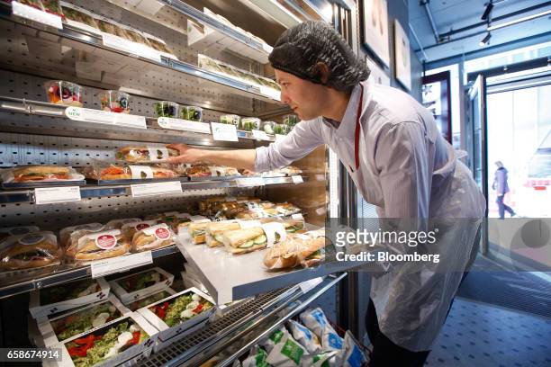 Chef re-stacks shelves with freshly made sandwich baguettes inside a branch of food retailer Pret a Manger Ltd. In London, U.K., on Monday, March 27,...