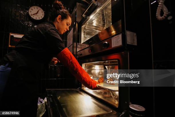 An employee prepares croissants inside a branch of food retailer Pret a Manger Ltd. In London, U.K., on Monday, March 27, 2017. Food chain Pret a...