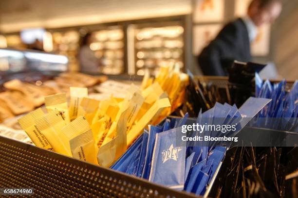 The Pret logo sits on packets of condiments inside a branch of food retailer Pret a Manger Ltd. In London, U.K., on Monday, March 27, 2017. Food...