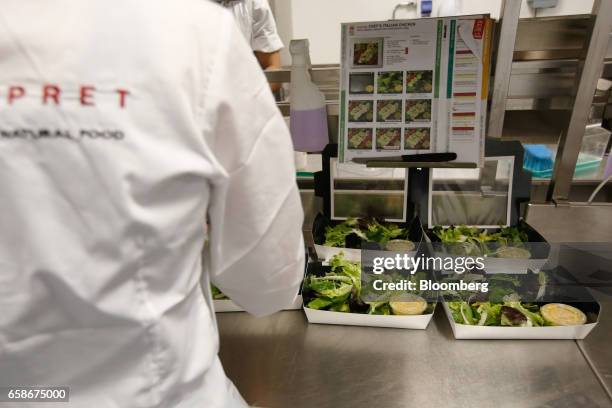 Chef prepares salad boxes in the kitchen of a branch of food retailer Pret a Manger Ltd. In London, U.K., on Monday, March 27, 2017. Food chain Pret...