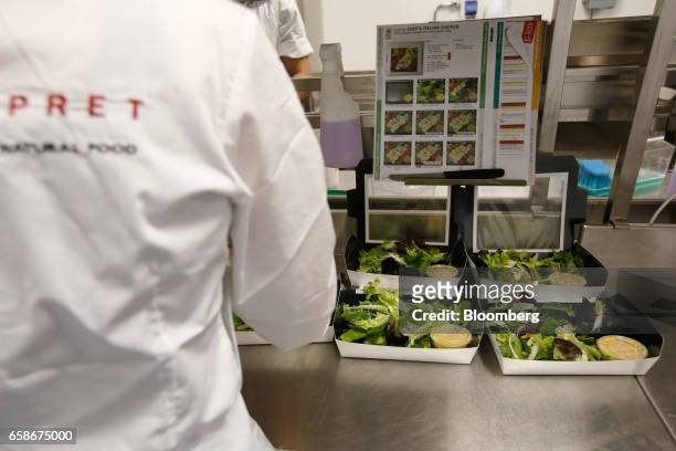 Chef prepares salad boxes in the kitchen of a branch of food retailer Pret a Manger Ltd. In London, U.K., on Monday, March 27, 2017. Food chain Pret...