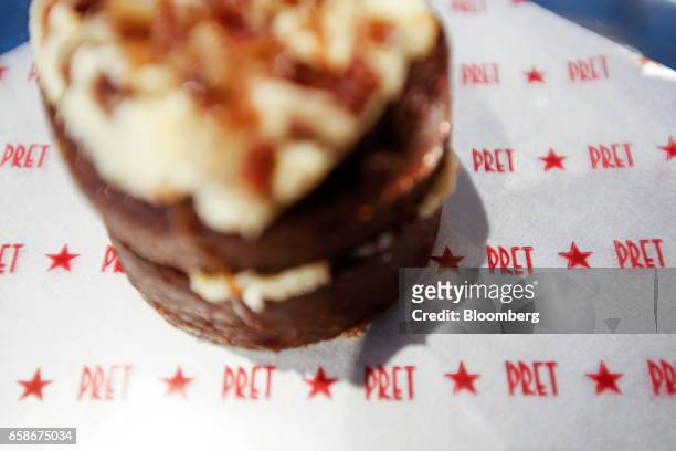 Cake sits on branded paper inside a branch of food retailer Pret a Manger Ltd. In this arranged photograph in London, U.K., on Monday, March 27,...