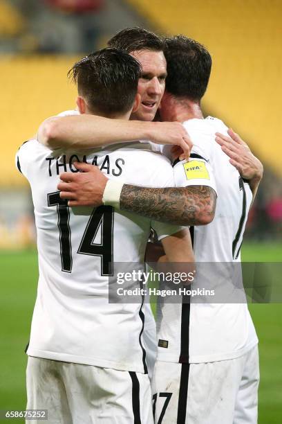 Ryan Thomas of New Zealand celebrates his goal with Shane Smeltz and Thomas Doyle during the 2018 FIFA World Cup Qualifier match between the New...