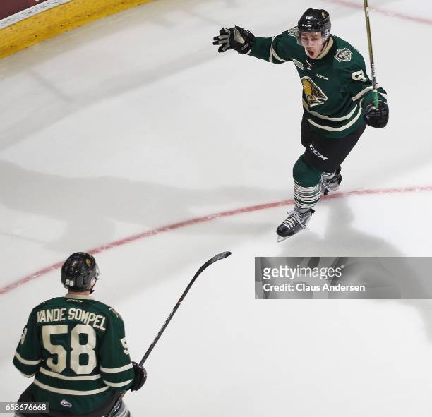 Mitchell Stephens of the London Knights celebrates his eventual game winning goal with teammate Mitchell Vande Sompel against the Windsor Spitfires...