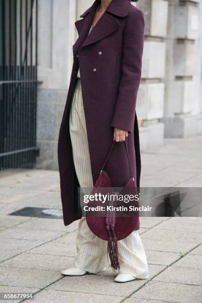 Fashion consultant Hikari Yokoyama wears a Mulberry coat, top and trousers and an Altuzarra bag on day 3 of London Womens Fashion Week Autumn/Winter...