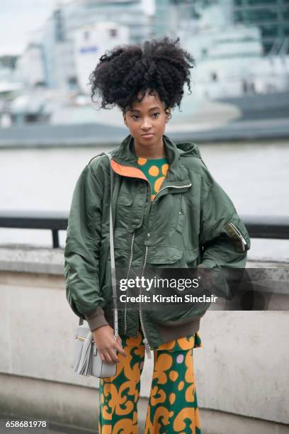 Social Media manager and editor for Barneys New York Candace Marie wears Mango boots, Sacai bomber jacket, Anya Hindmarch bag and a Marimekko top and...