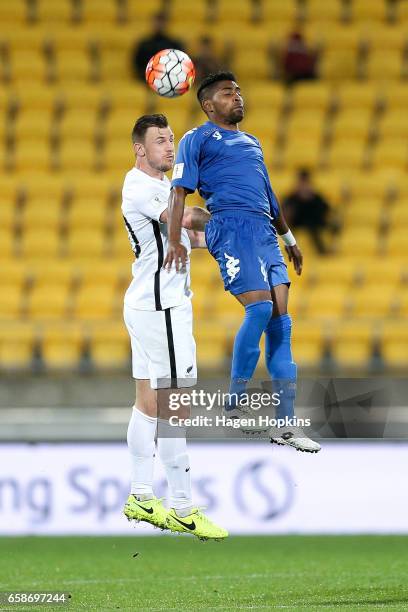 Tommy Smith of New Zealand and Roy Krishna of Fiji compete for a header during the 2018 FIFA World Cup Qualifier match between the New Zealand All...