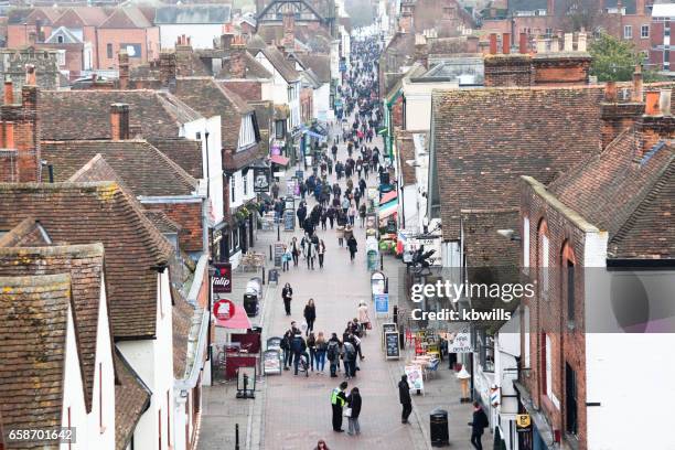 elevated view medieval street with tourists and locals in canterbury kent england - vertigo stock pictures, royalty-free photos & images