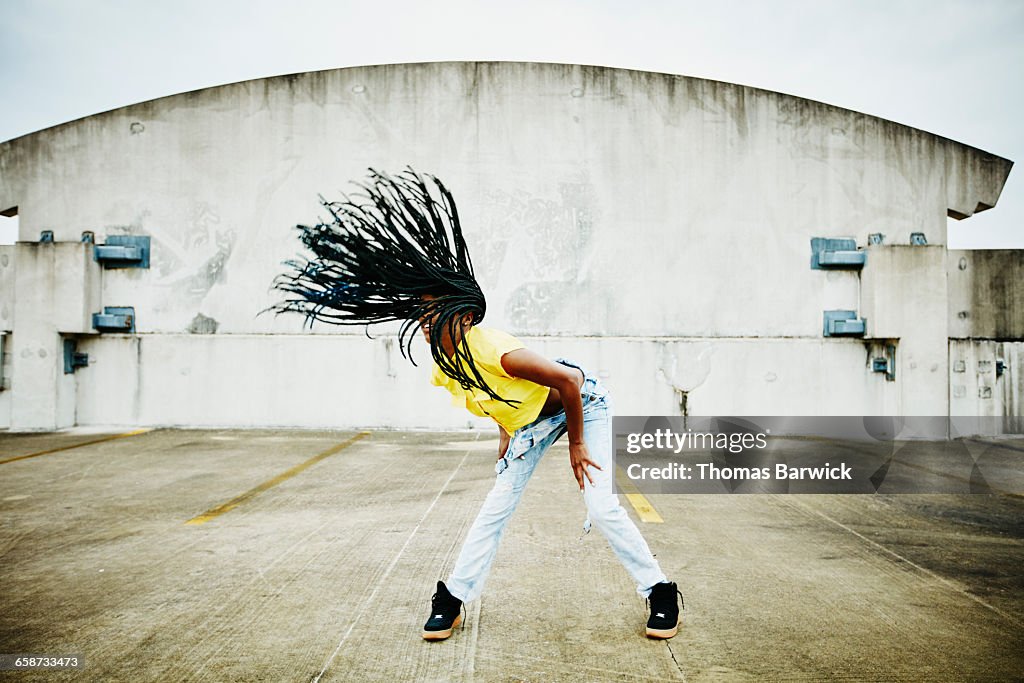 Female dancer flipping hair while dancing