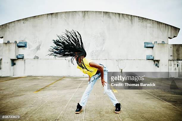 female dancer flipping hair while dancing - black culture stock pictures, royalty-free photos & images