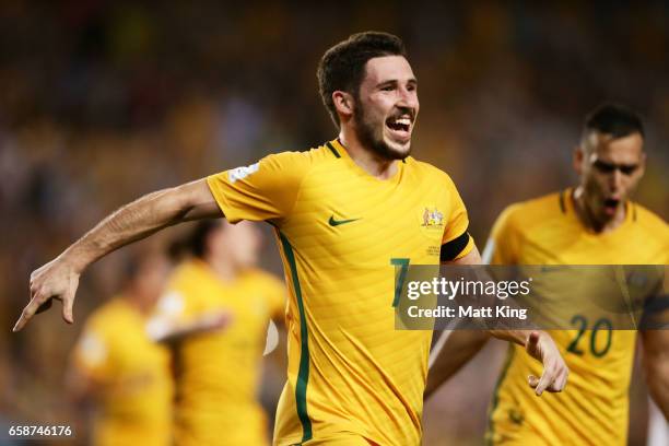 Mathew Leckie of the Socceroos celebrates scoring the second goal during the 2018 FIFA World Cup Qualifier match between the Australian Socceroos and...