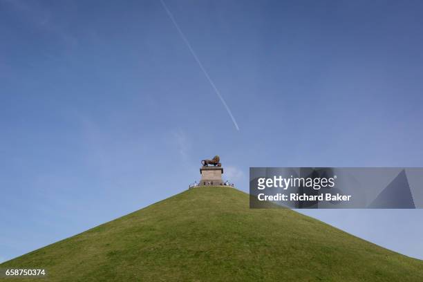 Visitors on the top of the 43 metre high Waterloo Lion's battlefield Mound, on 25th March 2017, at Waterloo, Belgium. The Lion's Mound (Butte du Lion...