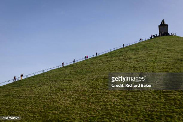 Visitors climb and descend the 225 steps, 43 metre high Waterloo Lion's battlefield Mound, on 25th March 2017, at Waterloo, Belgium. The Lion's Mound...