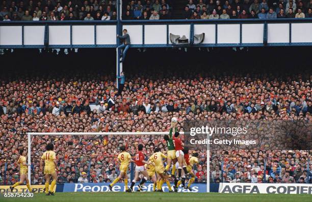 Two Liverpool fans climb up a stanchion to get a better view of the action during the 1985 FA Cup semi final between Liverpool and Manchester United...