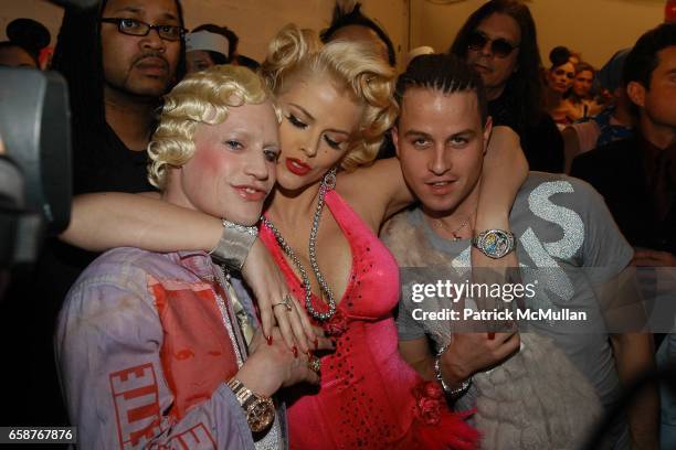 Richie Rich, Anna Nicole Smith and Traver Rains attend HEATHERETTE Fashion Show at the MAO Space on February 12, 2004 in New York City.