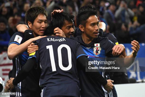 Shinji Kagawa of Japan celebrates scoring the opening goal with his team mates during the 2018 FIFA World Cup Qualifier match between Japan and...