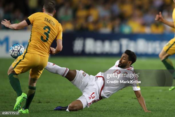 Brad Smith of the Socceroos is tackled by Khamis Esmaeel of the United Arab Emirates during the 2018 FIFA World Cup Qualifier match between the...