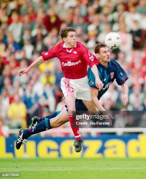 Tony Adams of Arsenal wins the ball ahead of Juninho of Middlesbrough during the FA Carling Premiership match between Middlesbrough and Arsenal at...