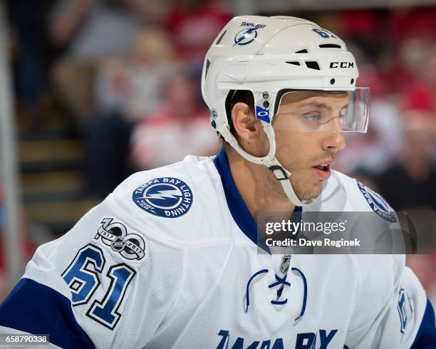 Gabriel Dumont of the Tampa Bay Lightning gets set for the face-off against the Detroit Red Wings during an NHL game at Joe Louis Arena on March 24,...