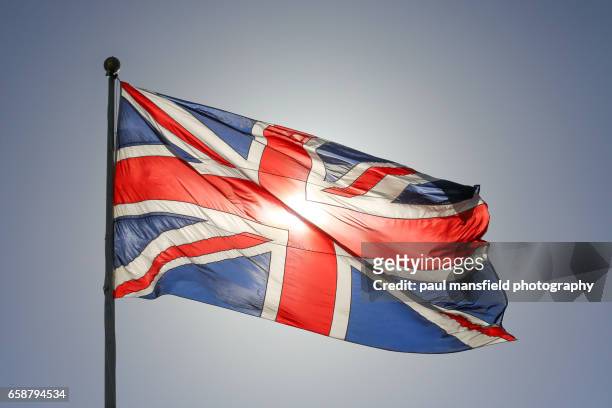 backlit union jack - uk flag stock pictures, royalty-free photos & images
