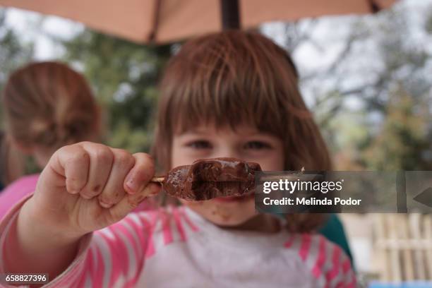 two-year old girl eating a popsicle - hot dirty girl stock pictures, royalty-free photos & images