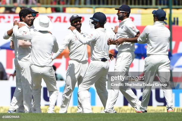 Umesh Yadav of India celebrates the wicket of David Warner of Australia during the 3rd day of their fourth test cricket match against Australia in...